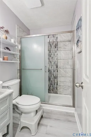 a view of house with a large window and furniture