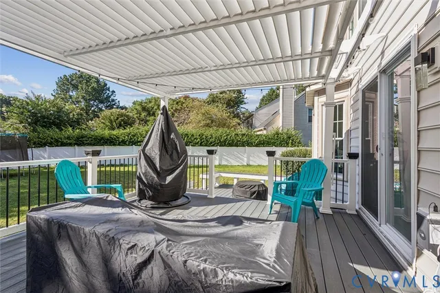 a front view of a house with a garden and yard