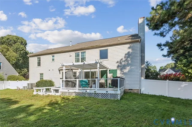 a view of a house with a yard porch and sitting area