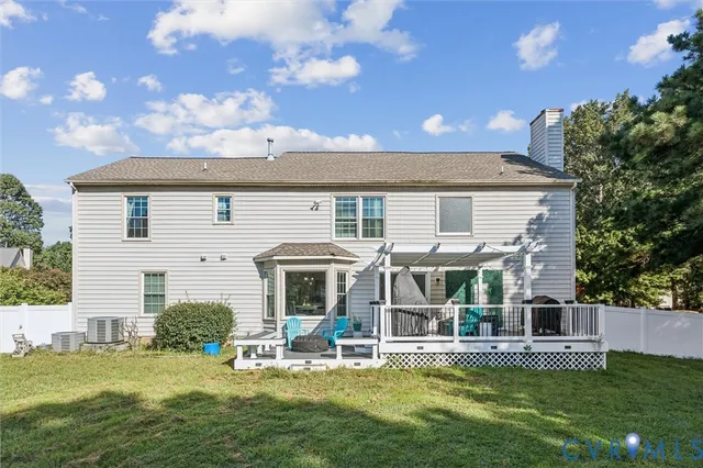 a view of swimming pool with seating space