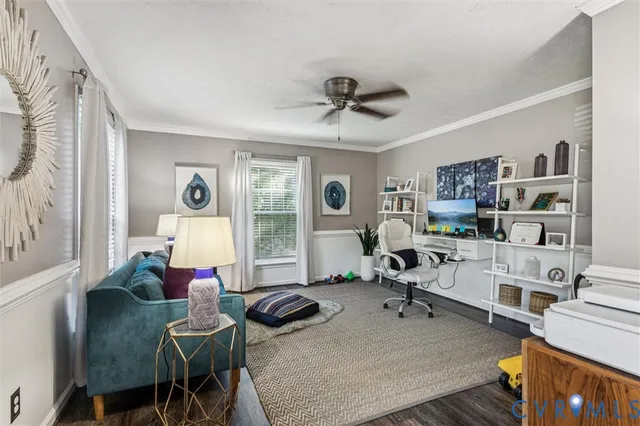 a living room with furniture a rug and a window