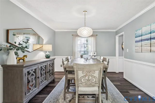 a view of a dining room and hall with furniture