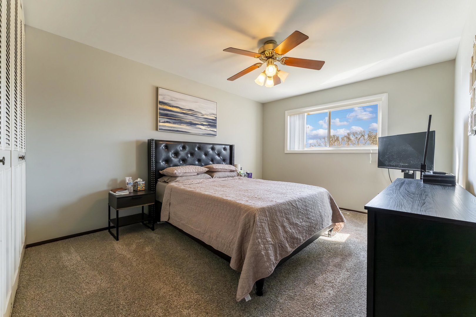 404 Arrow Trail Wheeling, IL 60090 - Photo 13 of 26 a bedroom with a bed and a flat screen tv