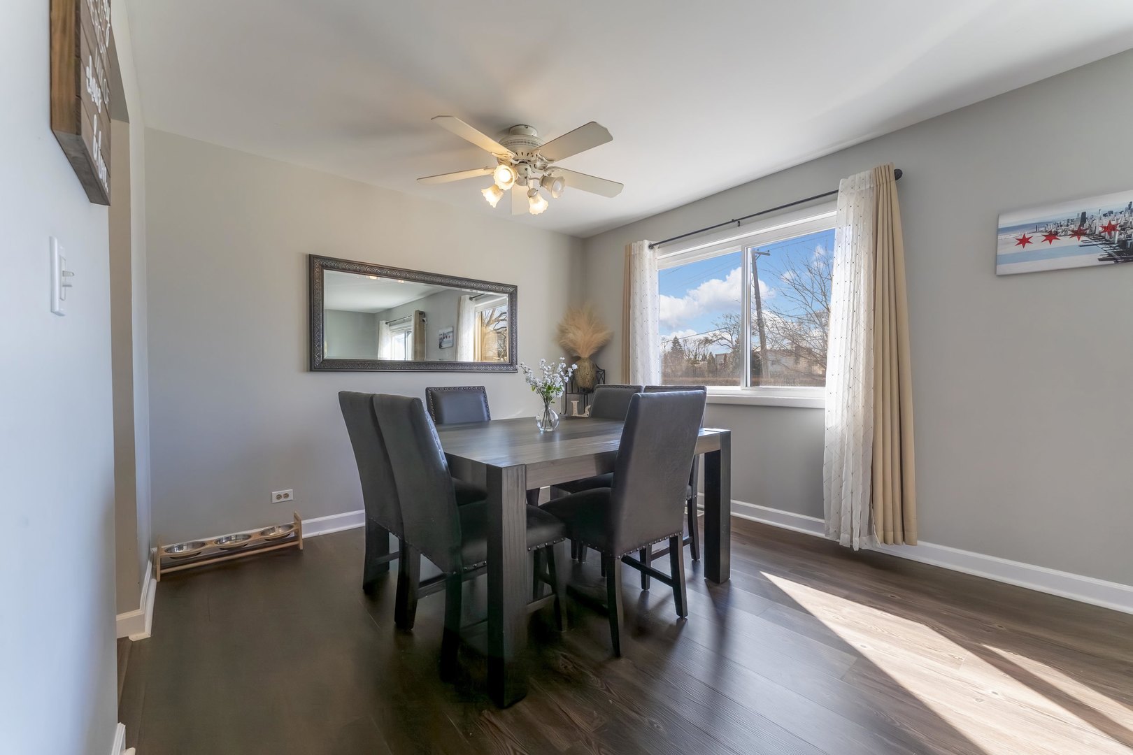 404 Arrow Trail Wheeling, IL 60090 - Photo 6 of 26 a view of a dining room with furniture window and wooden floor