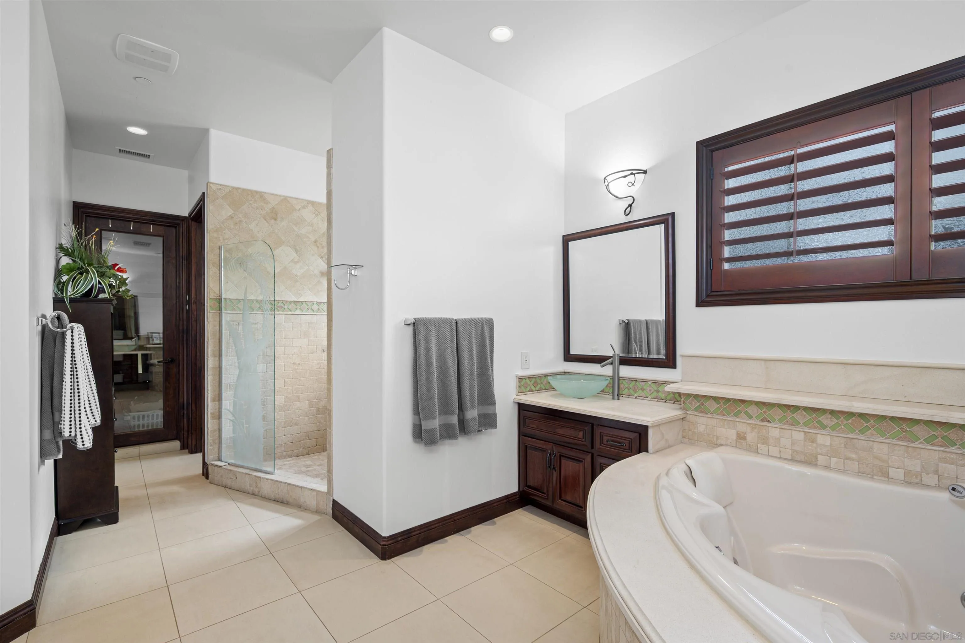 2882 Conestoga Circle Alpine, CA 91901 - Photo 40 of 75 a bathroom with a tub sink and mirror