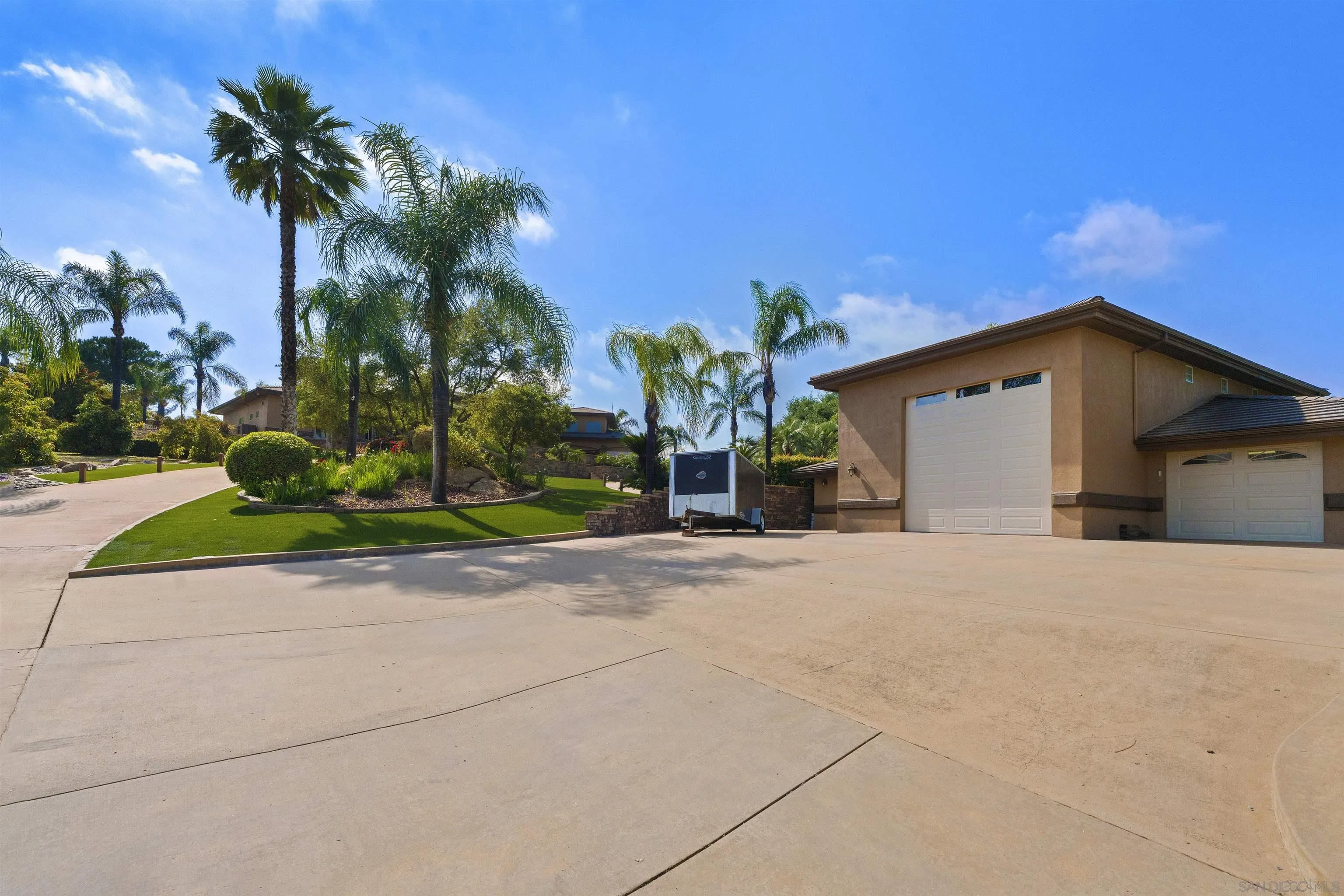 2882 Conestoga Circle Alpine, CA 91901 - Photo 63 of 75 a view of a house with palm trees and a small yard
