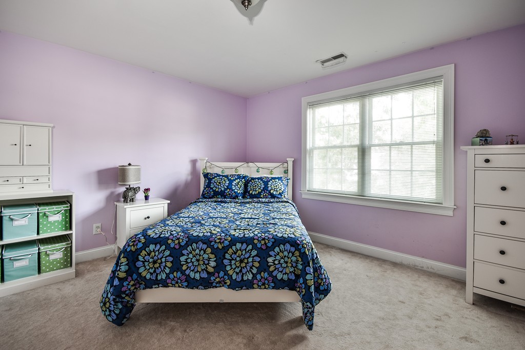 11 Marshall Road Wellesley, MA 02482 - Photo 12 of 18 a bedroom with a bed and a window
