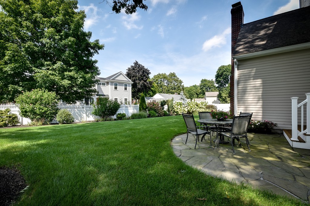 11 Marshall Road Wellesley, MA 02482 - Photo 18 of 18 a view of a house with backyard sitting area and garden