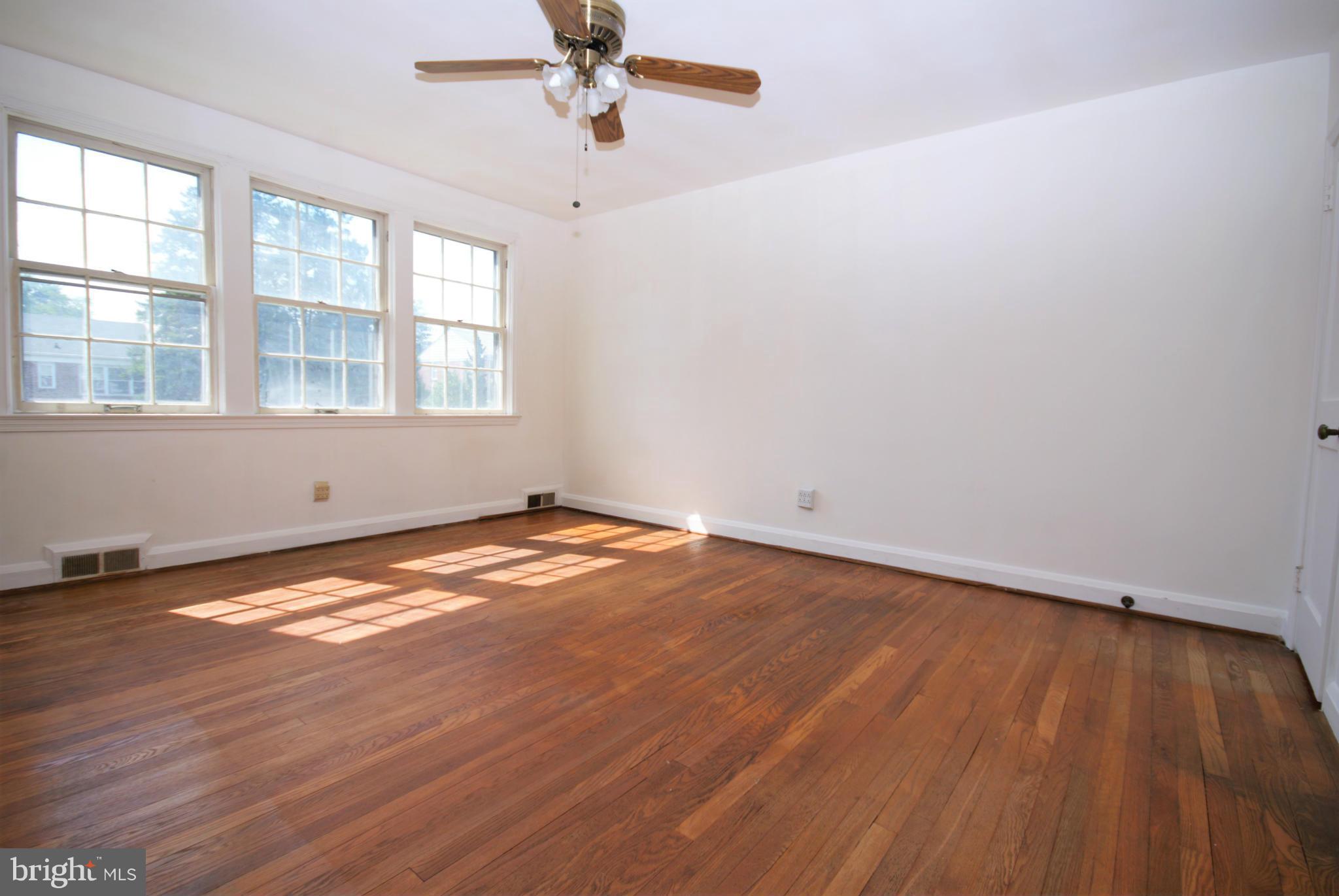 1854 Loch Shiel Road Baltimore, MD 21286 - Photo 12 of 23 wooden floor in an empty room with a window