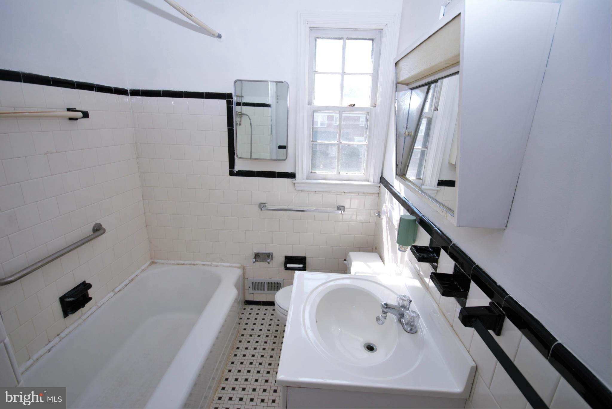 1854 Loch Shiel Road Baltimore, MD 21286 - Photo 15 of 23 a bathroom with a sink a toilet and bathtub