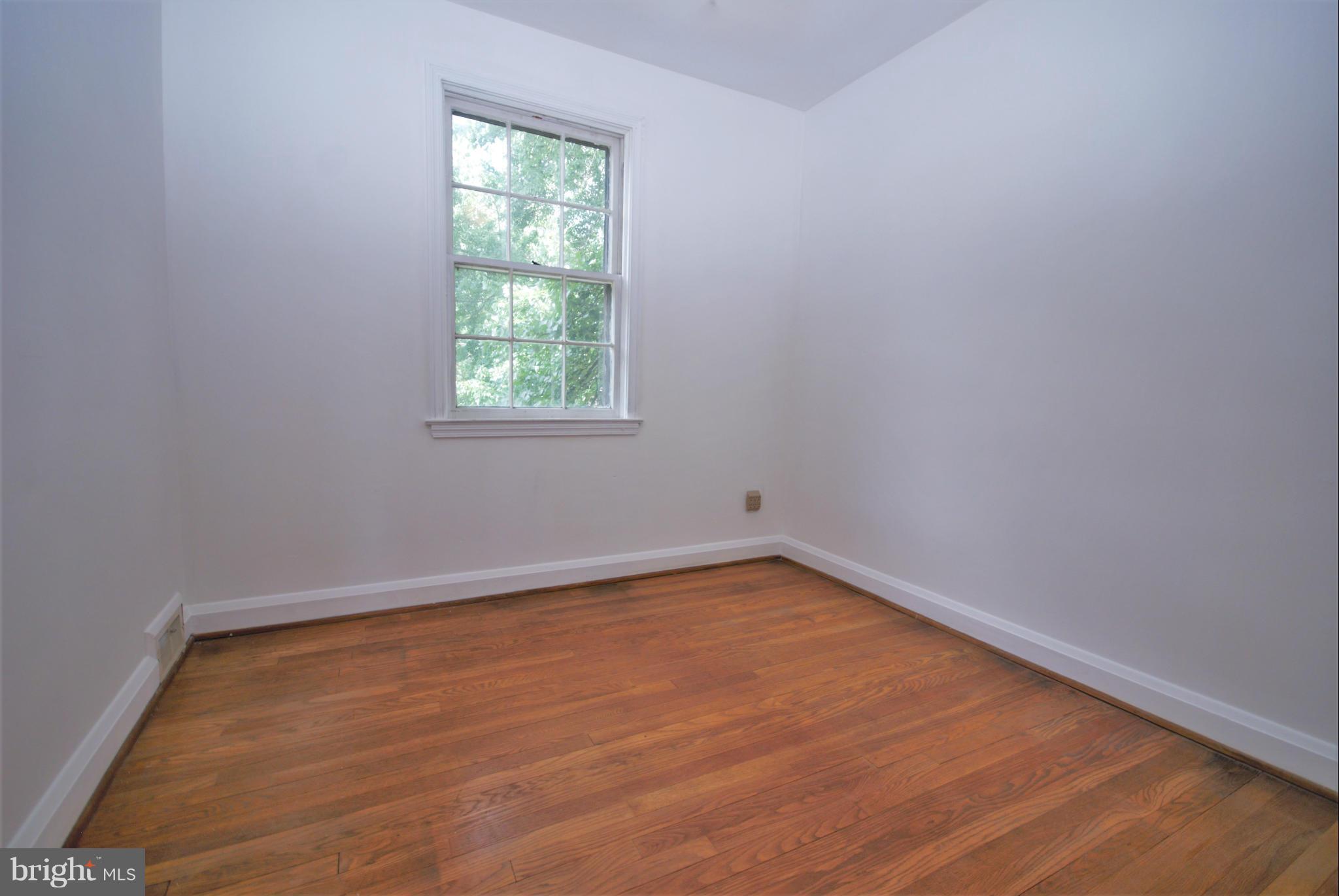 1854 Loch Shiel Road Baltimore, MD 21286 - Photo 16 of 23 a view of a room with wooden floor and window