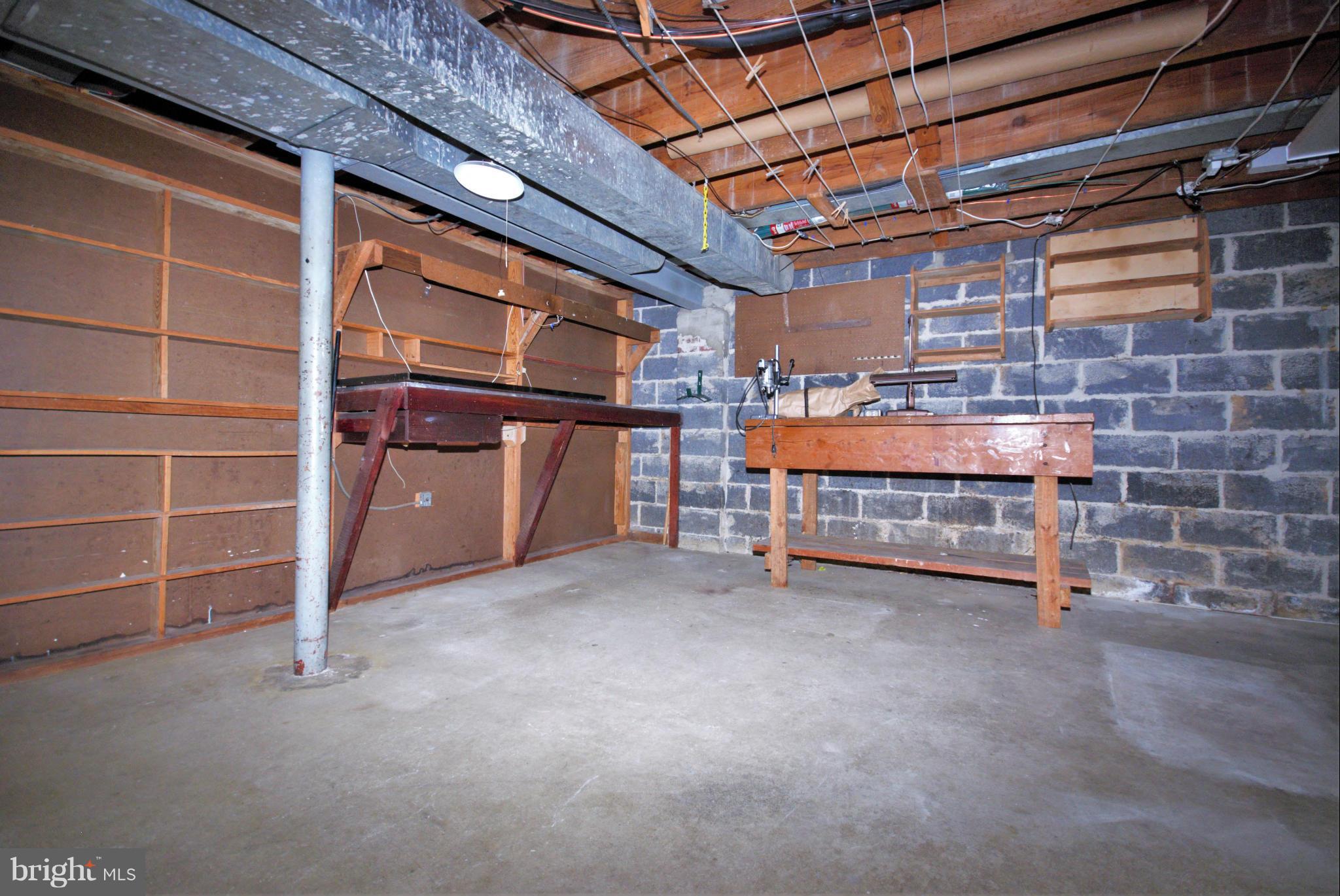 1854 Loch Shiel Road Baltimore, MD 21286 - Photo 21 of 23 a view of an empty room with a brick wall