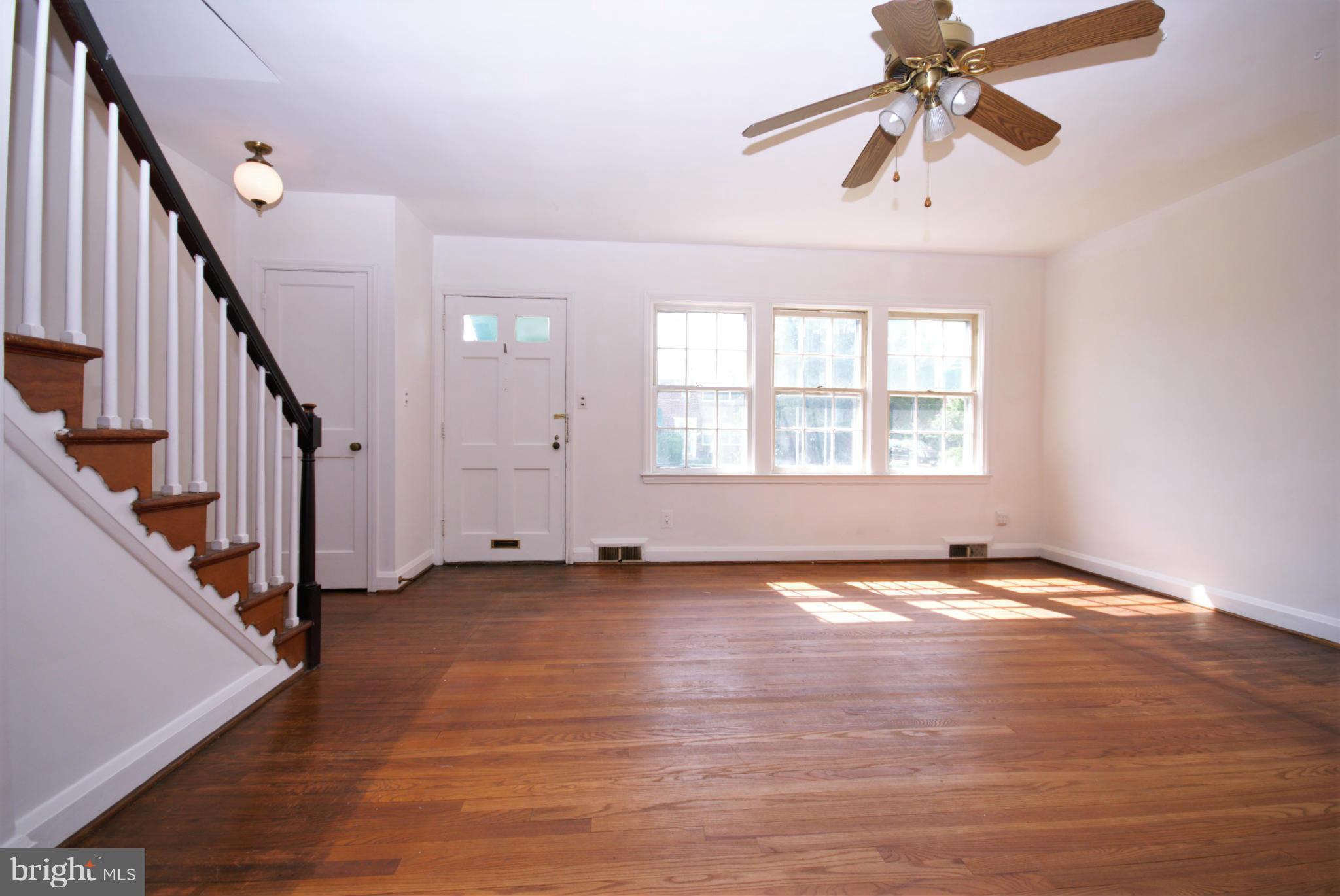1854 Loch Shiel Road Baltimore, MD 21286 - Photo 4 of 23 wooden floor in an empty room with a window