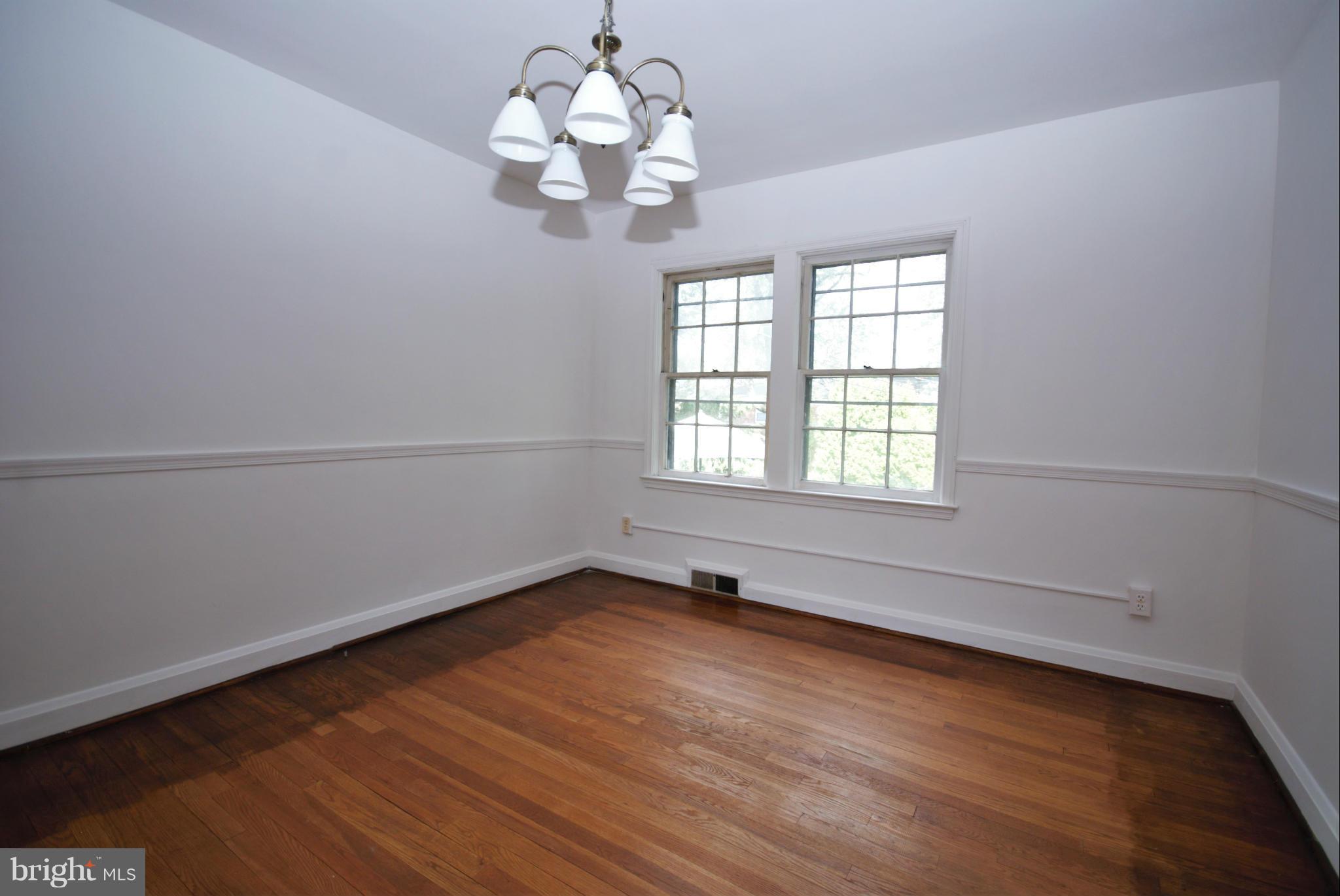 1854 Loch Shiel Road Baltimore, MD 21286 - Photo 6 of 23 wooden floor in an empty room with a window