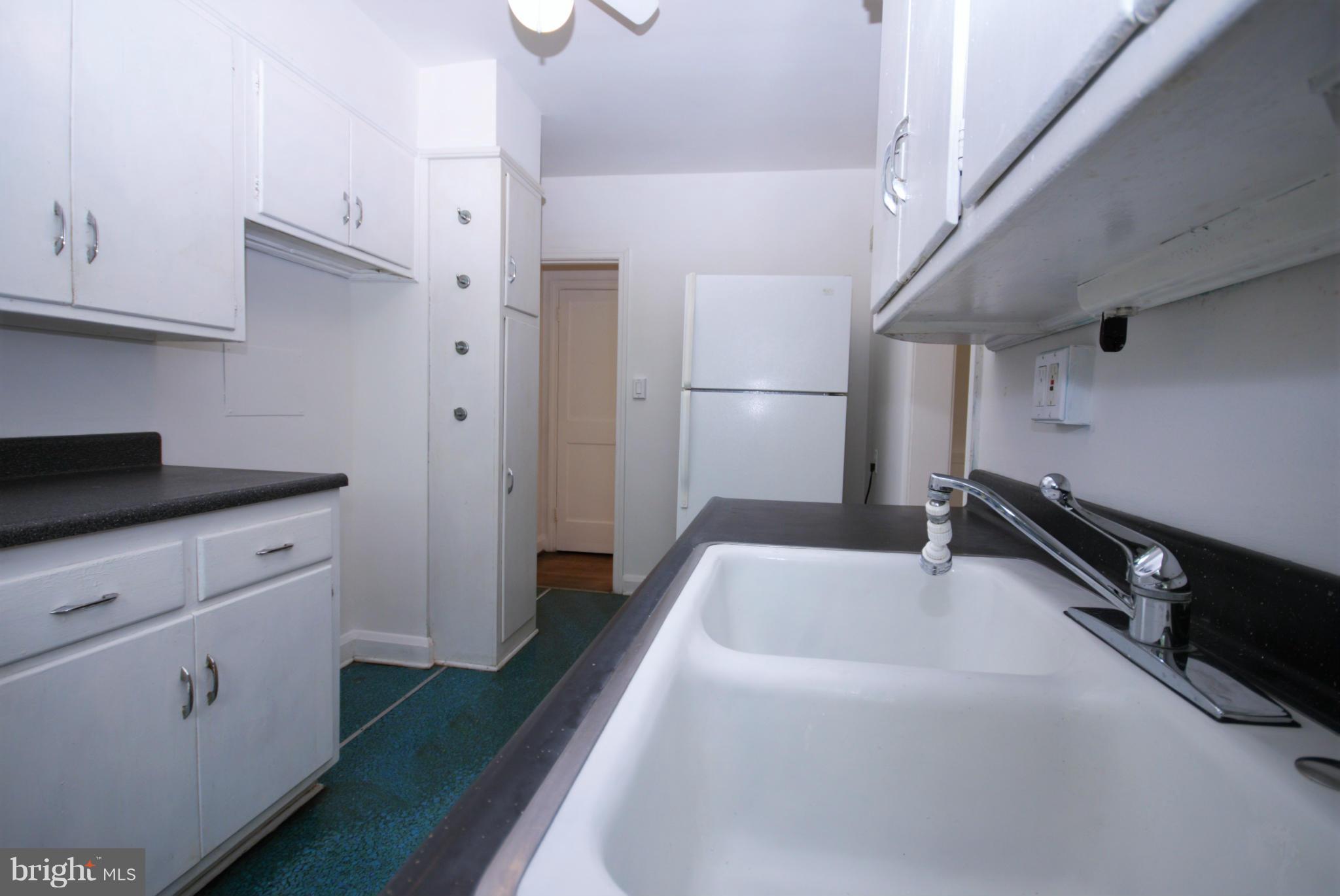 1854 Loch Shiel Road Baltimore, MD 21286 - Photo 9 of 23 a kitchen with refrigerator and window