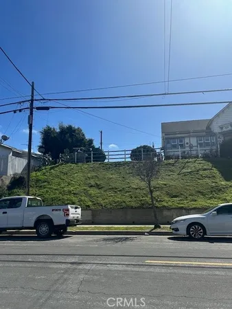 a view of a car is parked in front of a house