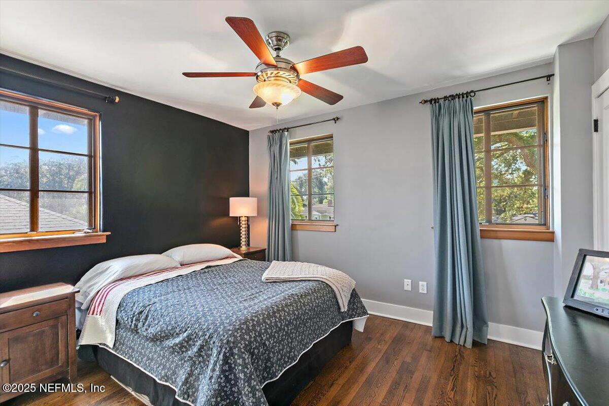 701 Old Hickory Road Jacksonville, FL 32207 - Photo 23 of 36 a bedroom with a large bed chandelier and a window