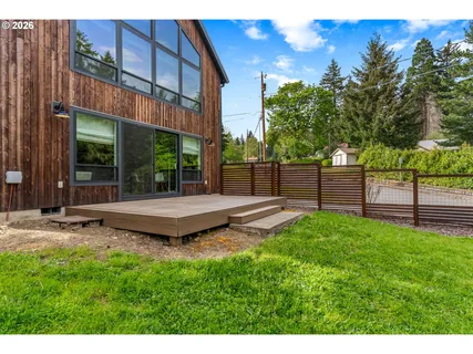 a view of a backyard with a garden and plants