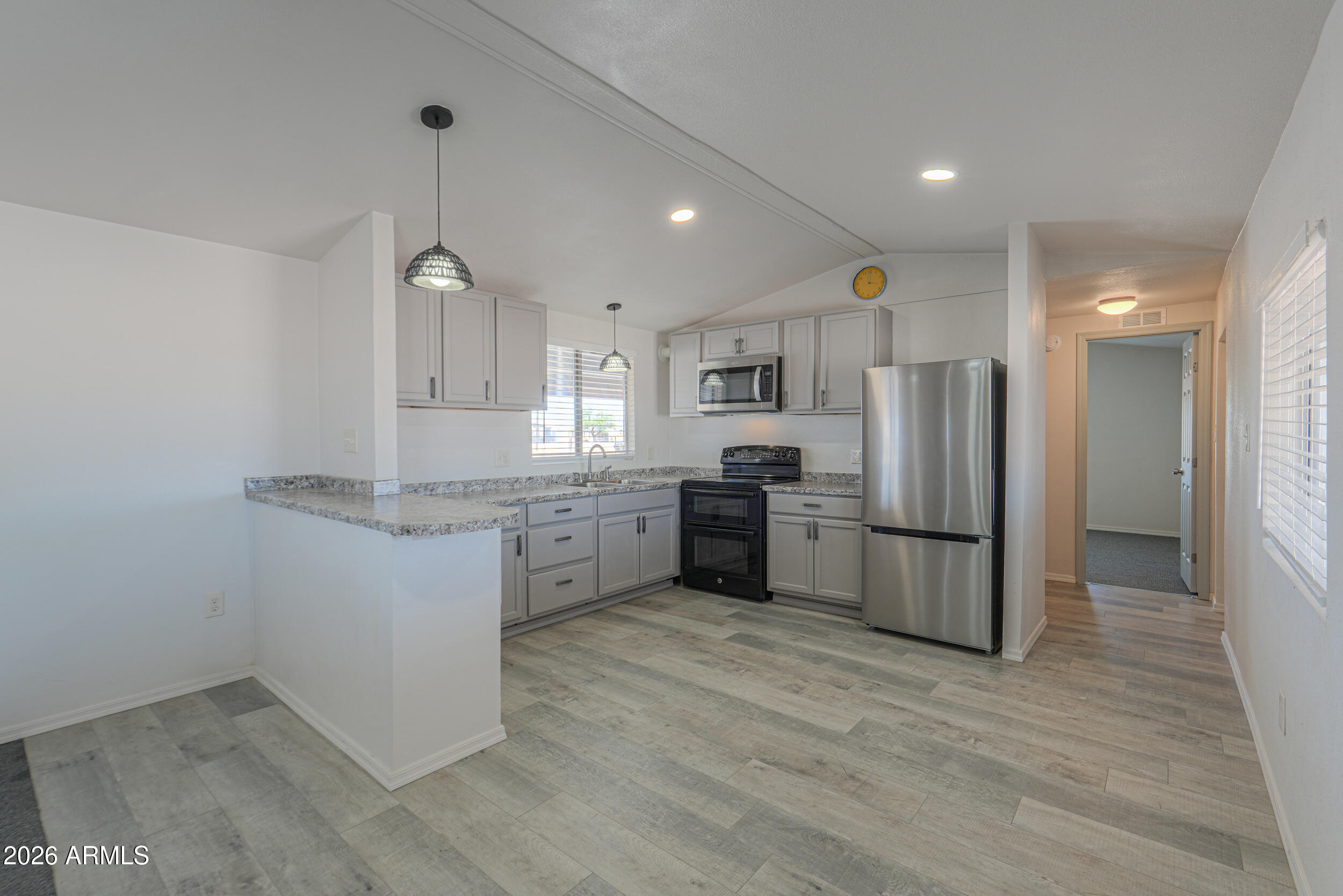 33776 West Siesta Road Stanfield, AZ 85172 - Photo 36 of 54 a kitchen with a refrigerator and a sink