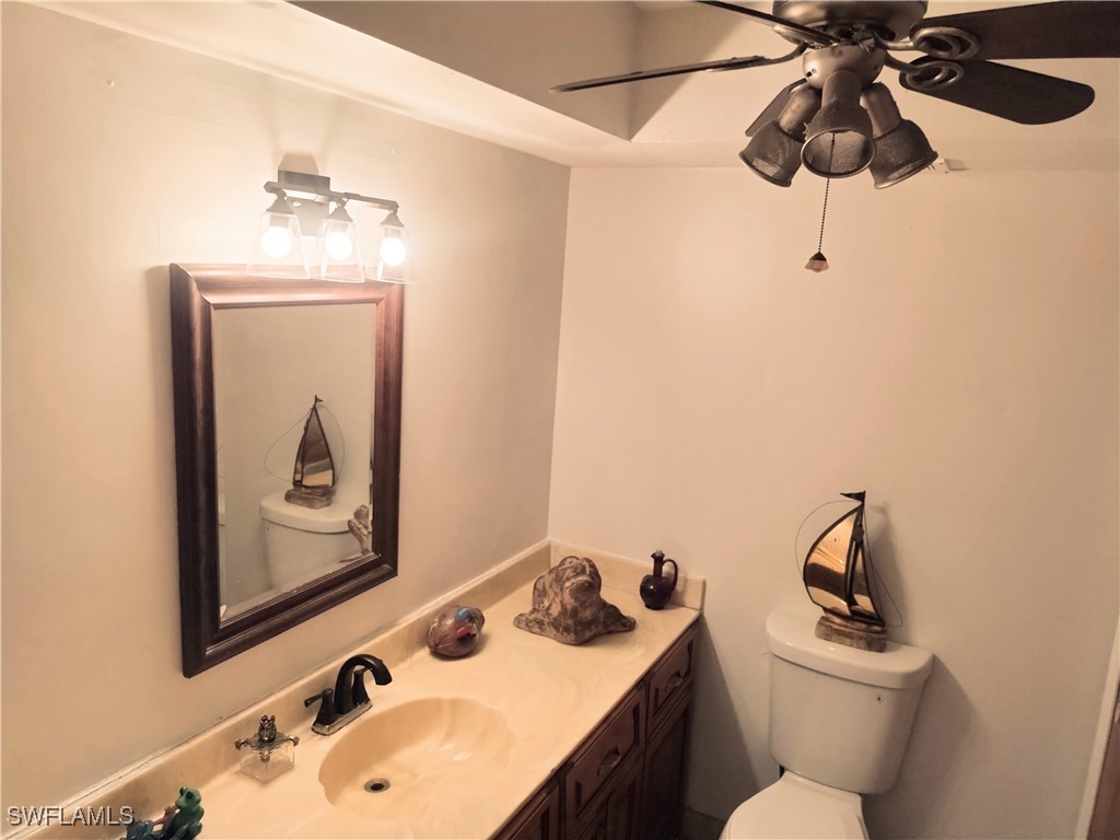 17091 Charlee Road Punta Gorda, FL 33955 - Photo 13 of 44 a bathroom with a sink vanity and toilet