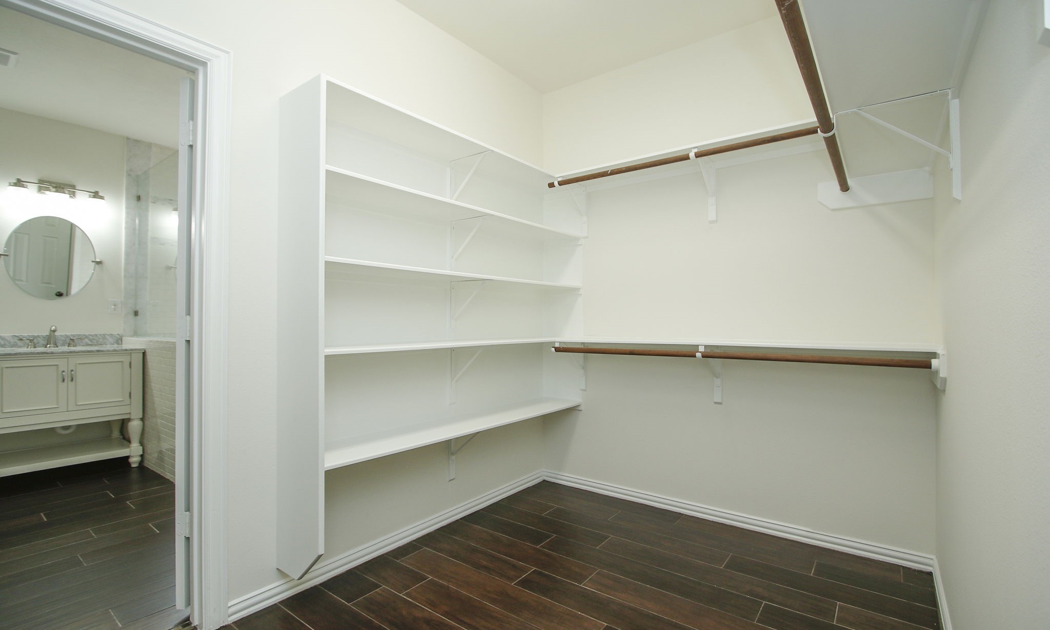 1210 Berwick Manor Court Spring, TX 77379 - Photo 32 of 50 a view of walk in closet with empty racks