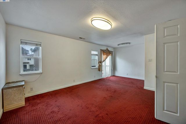 a view of empty room with windows