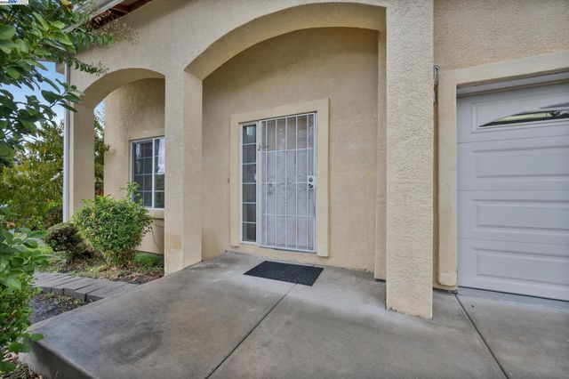 a view of a brick house with windows