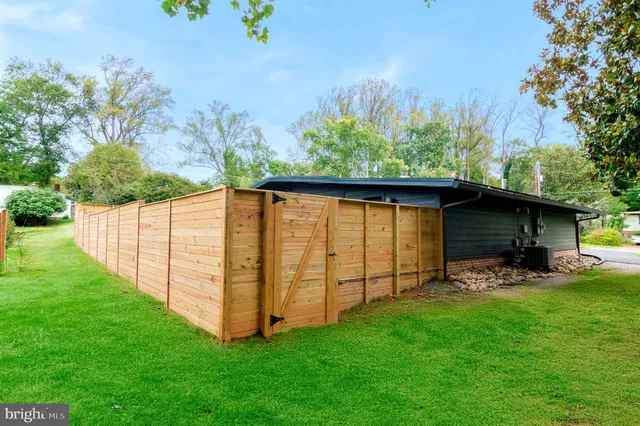 a backyard of a house with lots of green space
