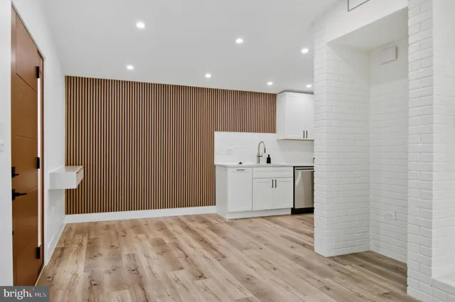 a view of kitchen with wooden floor