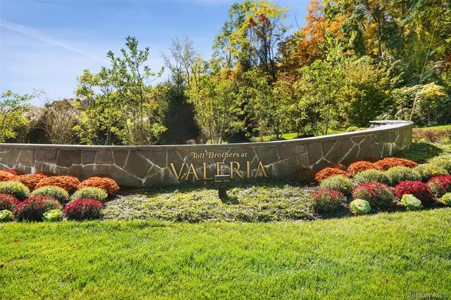 a front view of a house with outdoor seating