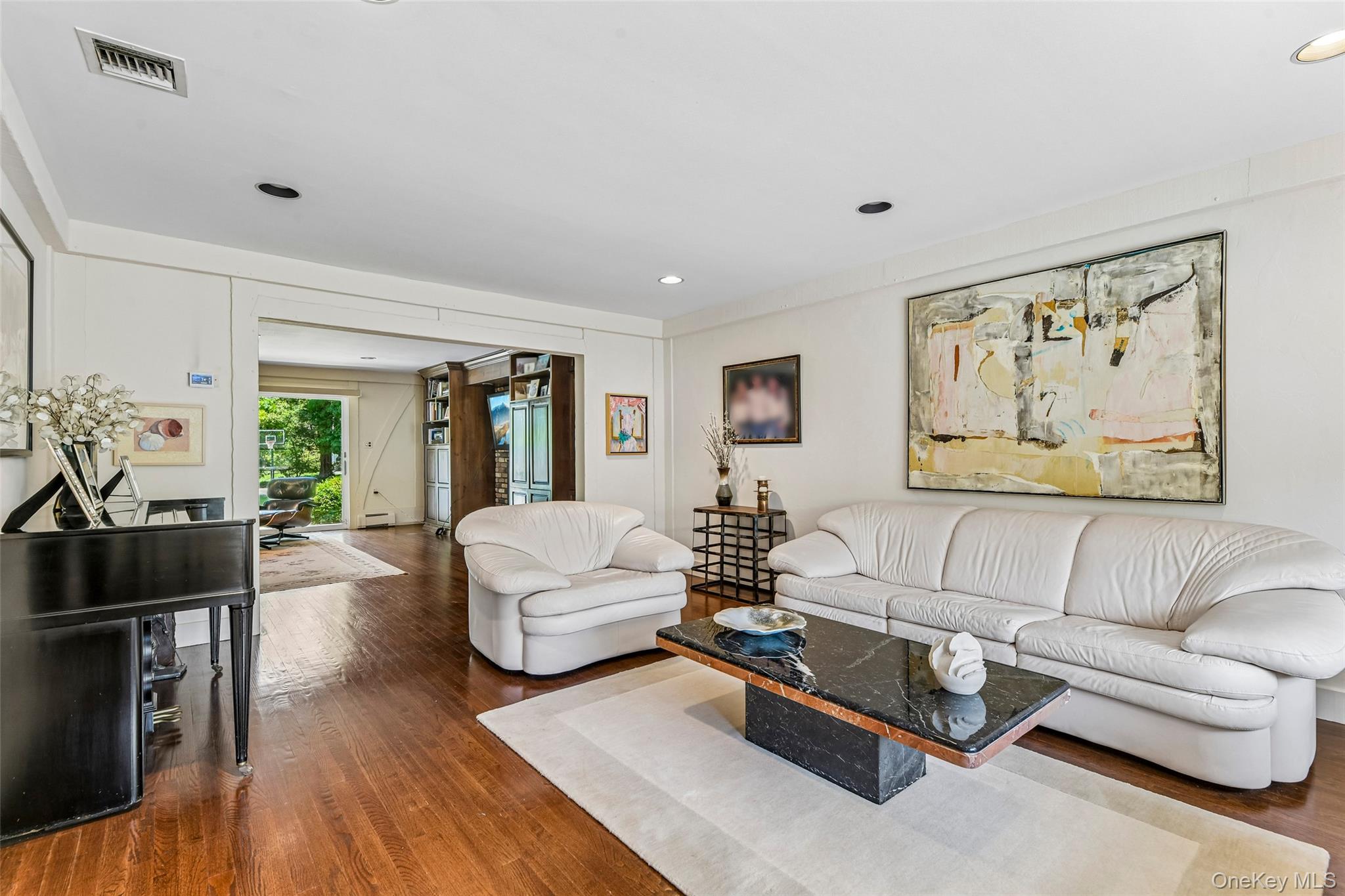 100 Hewlett Neck Road Woodmere, NY 11598 - Photo 9 of 45 a living room with furniture and wooden floor