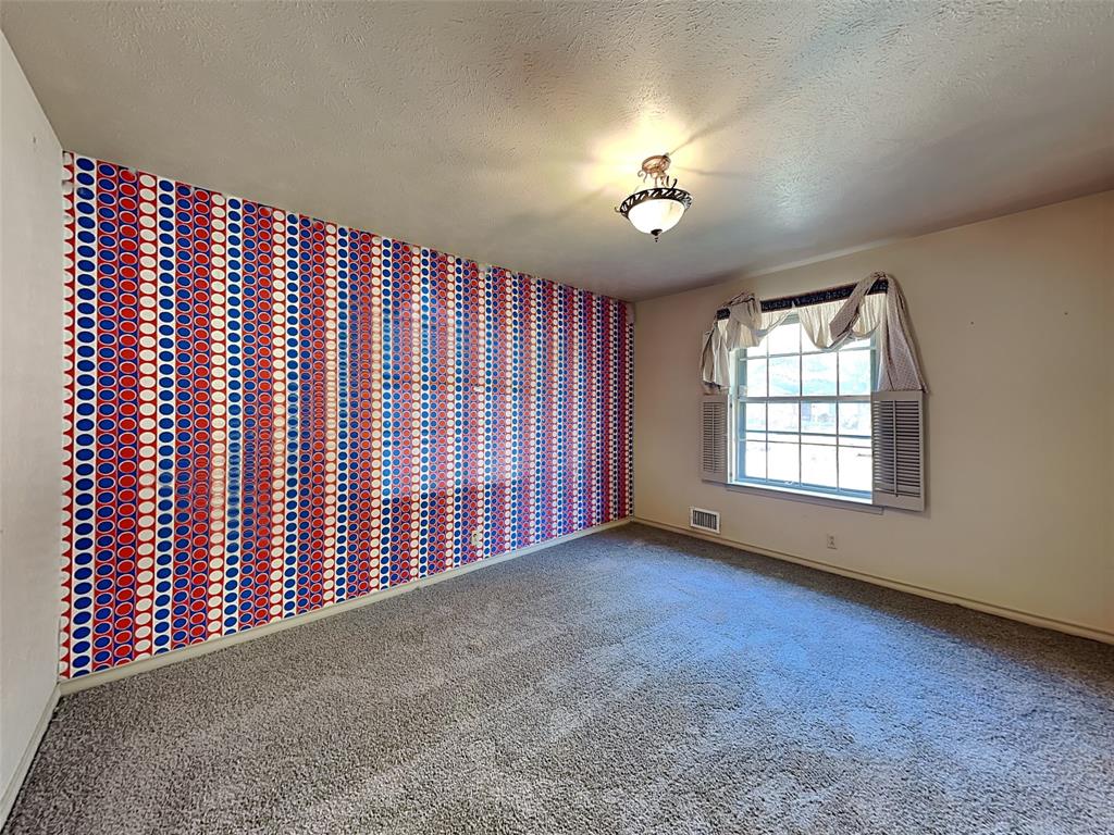 13630 Willow Bend Road Dallas, TX 75240 - Photo 11 of 17 a view of an empty room with a window