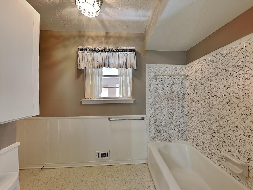 13630 Willow Bend Road Dallas, TX 75240 - Photo 15 of 17 a bathroom with a bathtub and a shower