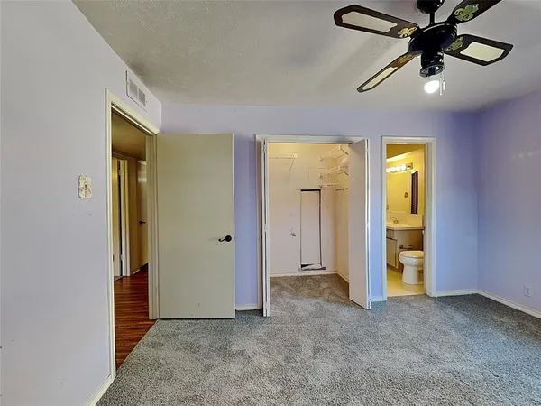 wooden floor in a hall with a window