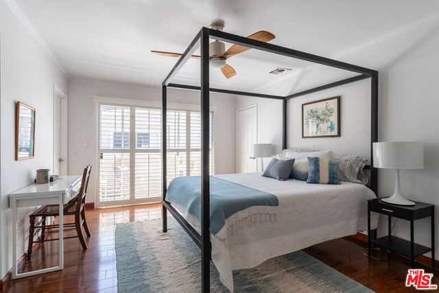 a bedroom with a bed and a table