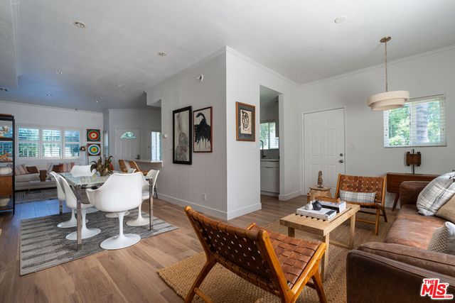 a living room with furniture a window and a table