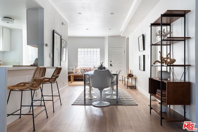 a view of a livingroom with furniture and a potted plant