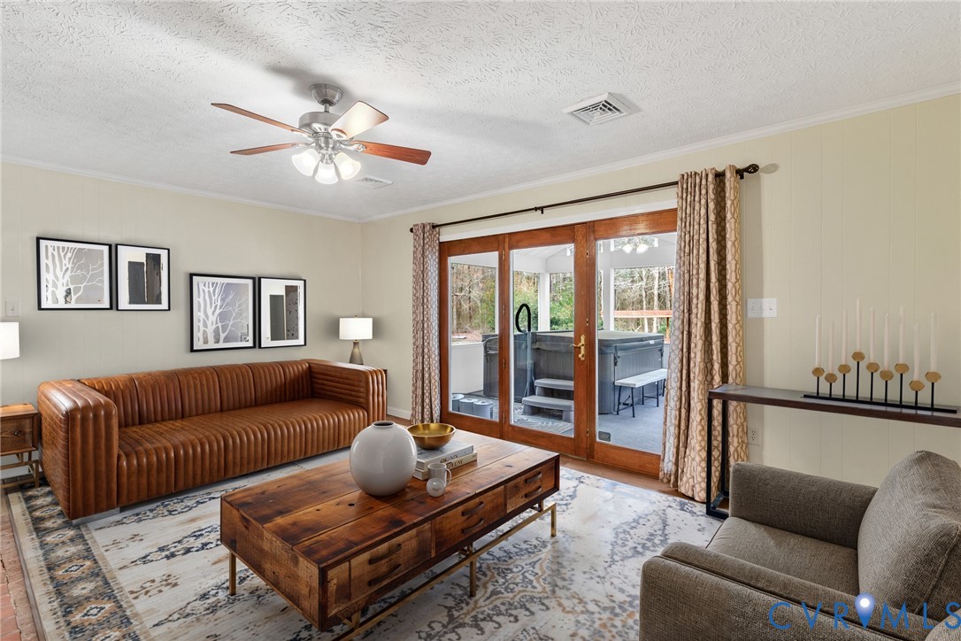 9829 Line Fence Road Hayes, VA 23072 - Photo 14 of 64 a living room with furniture ceiling fan and a rug