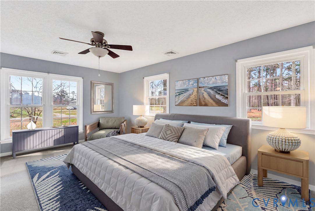 9829 Line Fence Road Hayes, VA 23072 - Photo 17 of 64 a bedroom with a large bed and a window