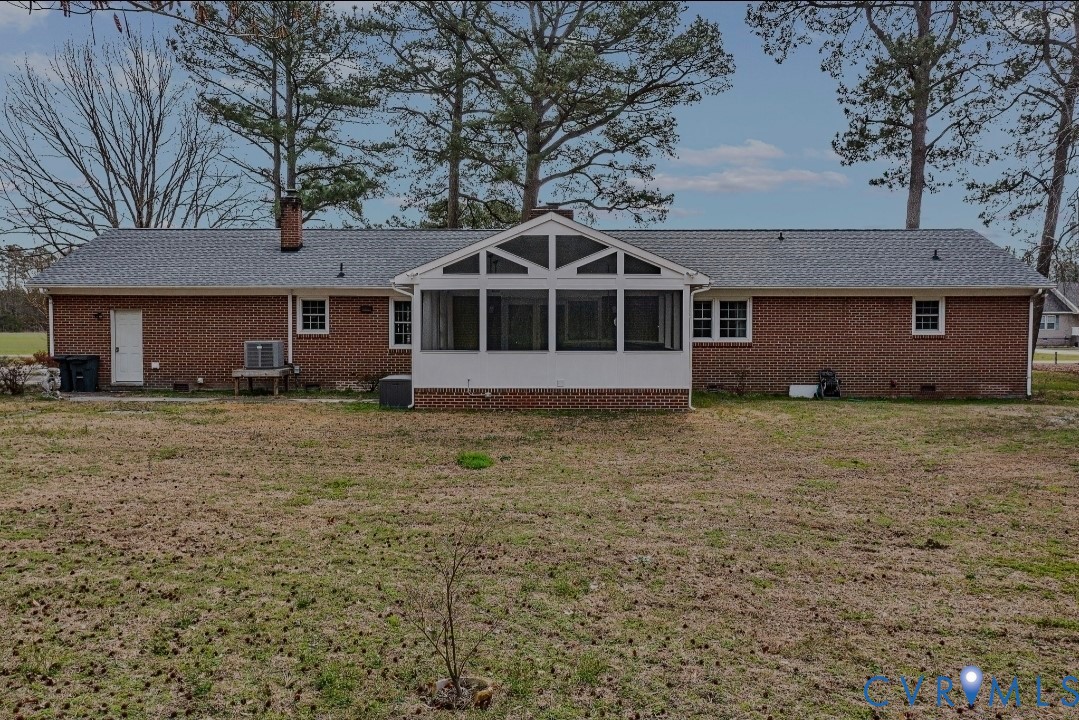 9829 Line Fence Road Hayes, VA 23072 - Photo 50 of 64 a front view of a house with a garden