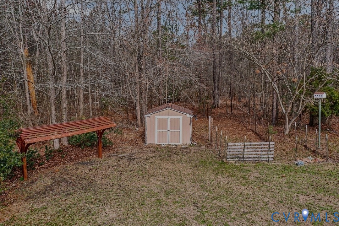 9829 Line Fence Road Hayes, VA 23072 - Photo 53 of 64 an aerial view of a house with a yard and wooden fence