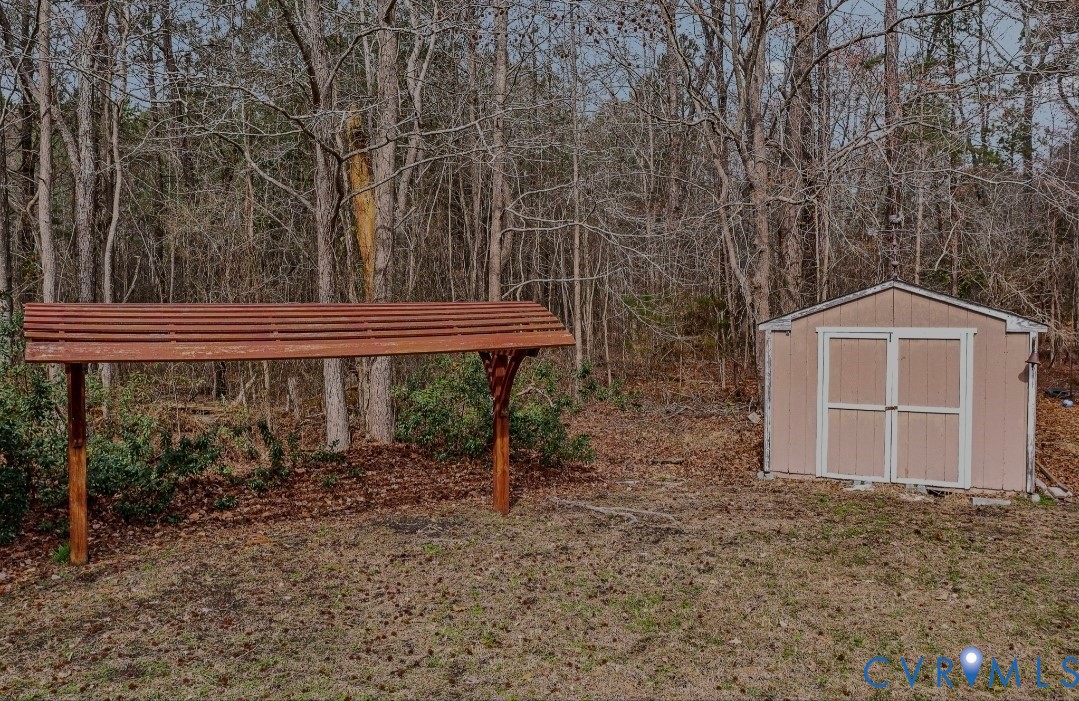 9829 Line Fence Road Hayes, VA 23072 - Photo 54 of 64 a front view of a house with garden