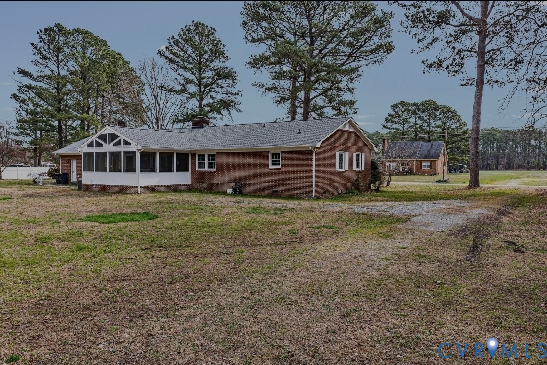 9829 Line Fence Road Hayes, VA 23072 - Photo 55 of 64 a front view of a house with garden