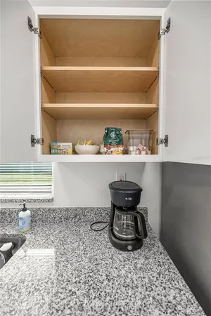 a kitchen with a sink and a stove