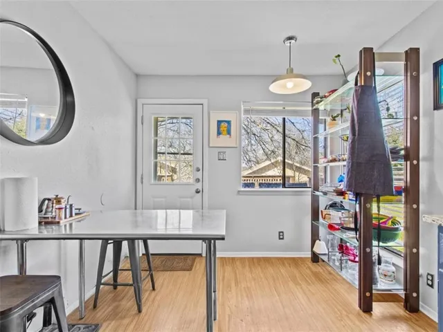 a view of a livingroom with furniture and hardwood floor