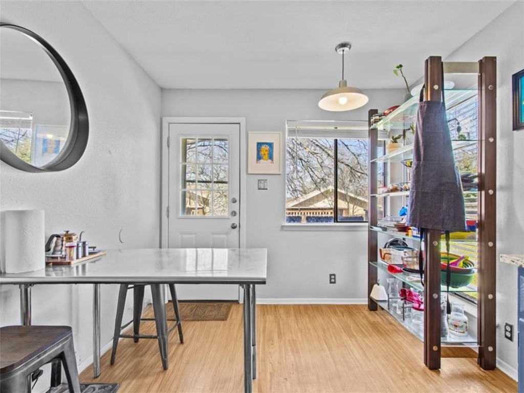2800 Burleson Road Austin, TX 78741 - Photo 13 of 35 a view of a livingroom with furniture and hardwood floor