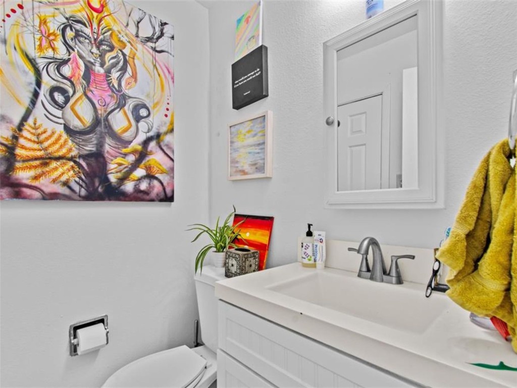 2800 Burleson Road Austin, TX 78741 - Photo 25 of 35 a bathroom with a sink and a mirror