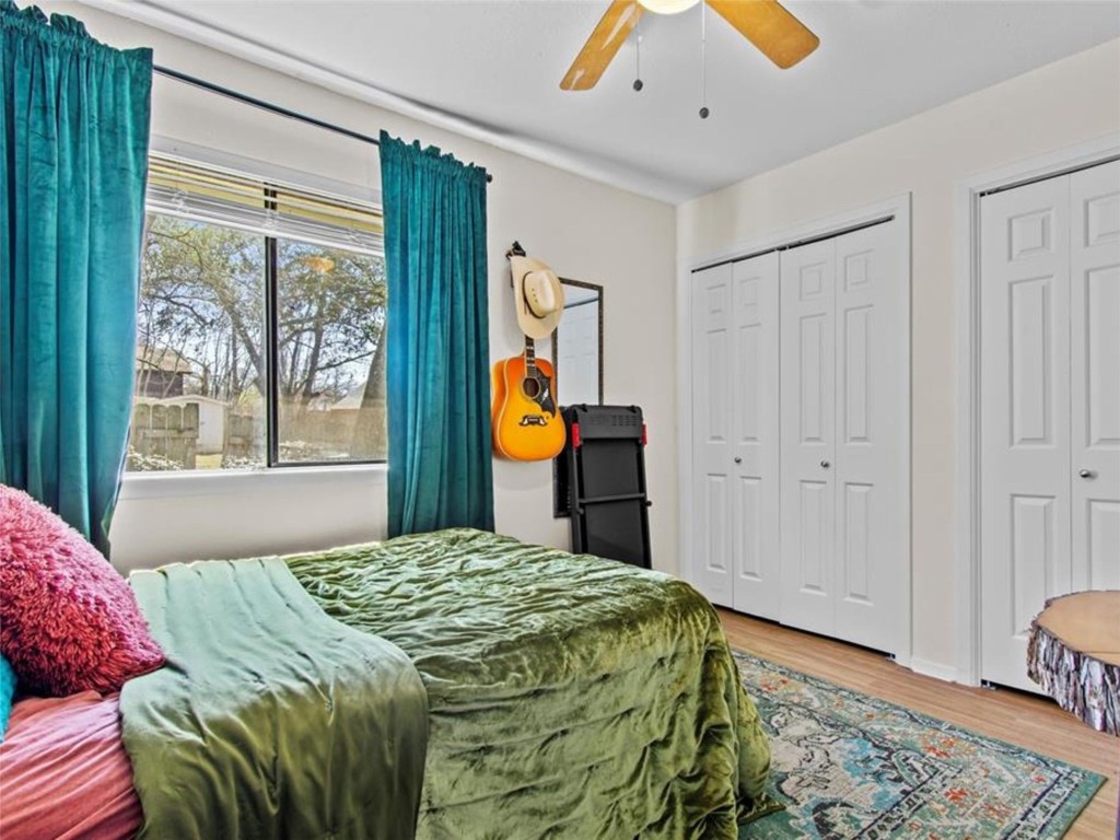 2800 Burleson Road Austin, TX 78741 - Photo 28 of 35 a bedroom with a bed and a window