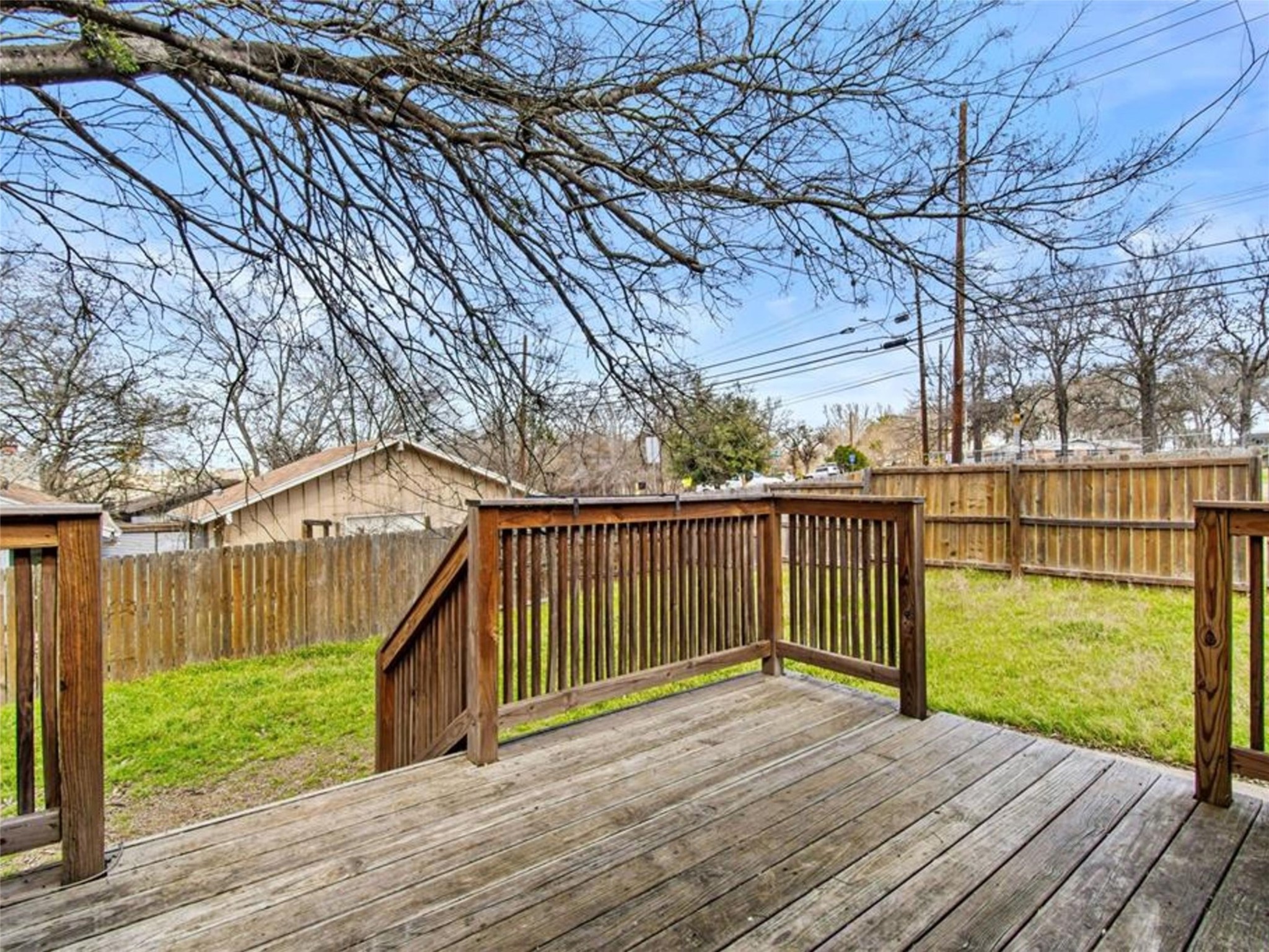 2800 Burleson Road Austin, TX 78741 - Photo 32 of 35 a view of deck with wooden floor and fence next to a yard