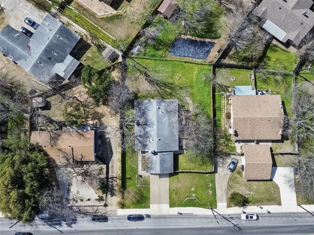 an aerial view of multiple houses with outdoor space